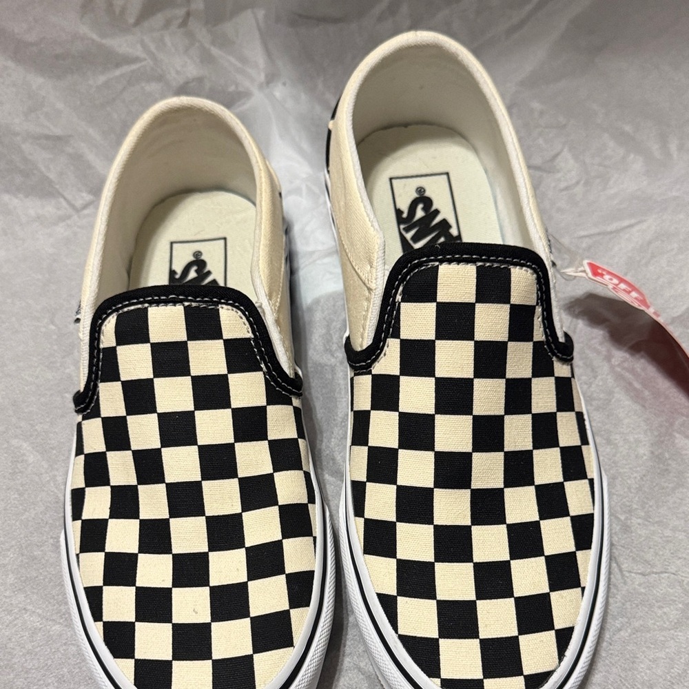 Vans Black and Cream Checkered Slip-On Sneakers